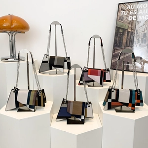 Minimalist geometric patchwork shoulder bags in various color combinations with chain straps