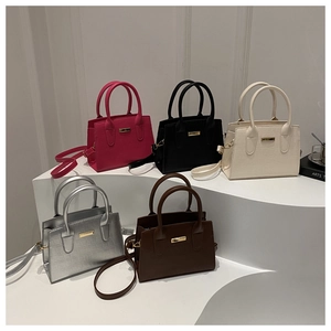 Five assorted vintage PU leather handbags with crocodile texture and metal accents