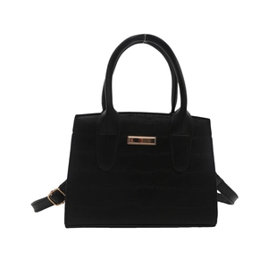 Minimalist black handbag with crocodile embossed texture and golden metal accent