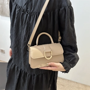 Chic beige square crossbody bag with gold horseshoe buckle and top handle for women