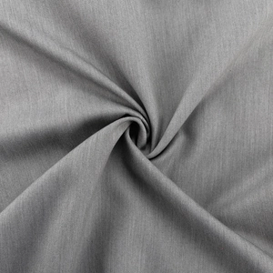 Detailed macro view of grey twill woven fabric showing fine texture and elegant drape