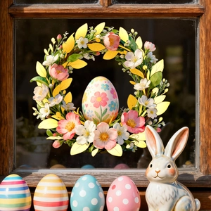Easter floral wreath window sticker with colorful eggs and ceramic bunny on wooden sill
