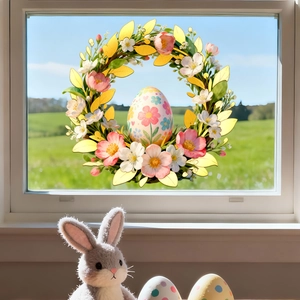 Easter window sticker showing floral wreath and egg decal on glass with a garden background
