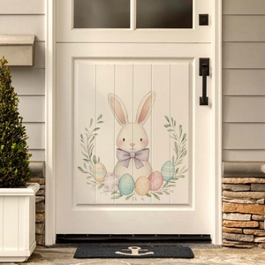 Close-up of Easter bunny and colorful eggs wall sticker on a white wooden door