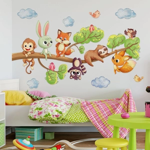 Detail of forest animal wall stickers with monkeys and foxes on a cozy nursery wall