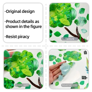 Detail of green tree wall stickers showing PVC texture, leaf patterns, and adhesive backing