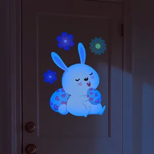 Luminous Easter bunny wall sticker with blue glowing effect and floral egg design