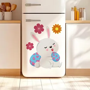 Easter luminous bunny wall sticker with blue egg and floral accents on a fridge