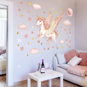 Detail of pink unicorn wall stickers with gold stars on a lavender bedroom wall