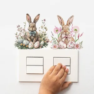 Detail van Paashaas wandschakelaar stickers met aquarel bloemen op een witte muur