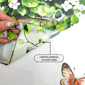 Detail showing double-sided color printing on translucent floral window stickers