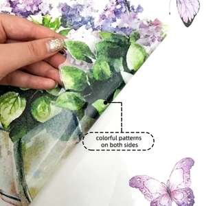 Detail of double-sided butterfly and purple flower window cling with transparent backing