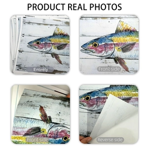 Detail of self-adhesive watercolor fish wall decals with white wood texture background