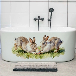 Waterproof Easter bunny and colorful eggs decorative sticker applied on a white bathtub