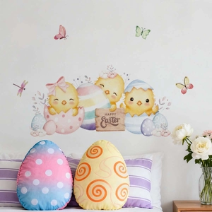 Detailed view of watercolor Easter wall decals with chicks and colorful eggs on a white wall