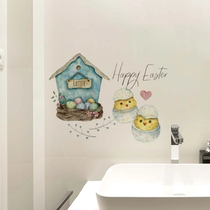 Close-up of Happy Easter birdhouse and chick stickers on white bathroom tiles