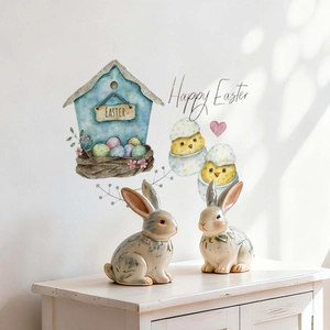 Close-up of Easter wall decals with watercolor birdhouse, chicks, and eggs on a white wall