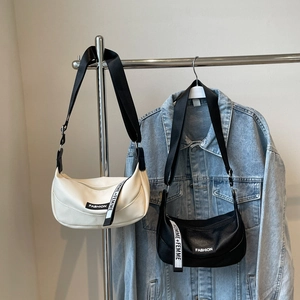 Chic lychee pattern crescent bag with wide shoulder strap in cream and black colors