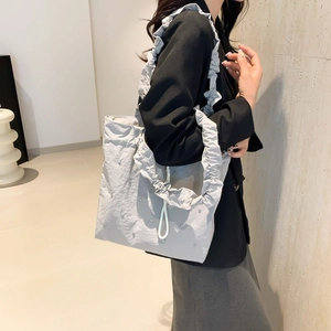 Minimalist light grey pleated tote bag with rhinestone accents and ruffled straps