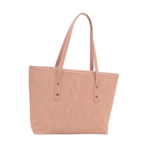 Pink matte leather tote bag with long handles and metallic rivet details on white background