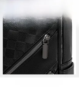 Detail of checkered embossed black leather backpack with gunmetal zipper and smooth texture