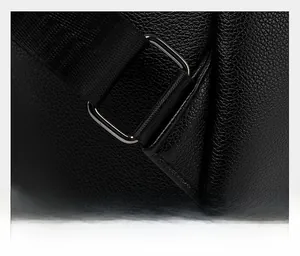 Detailed shot of reinforced stitching and metal hardware on a black leather backpack