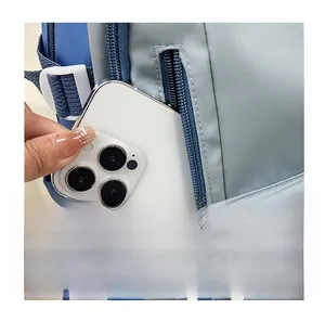 Detailed view of the hidden side zipper pocket on a waterproof nylon backpack