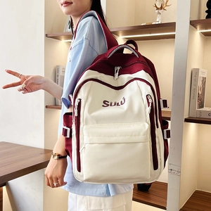Close-up of the vintage color-block backpack with adjustable straps and front pocket