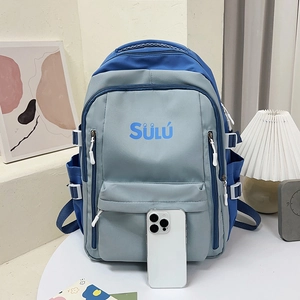 Detail of the multi-pocket design and SULU logo on the retro contrast color backpack