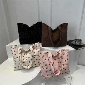 Corduroy tote bag with strawberry print in four colors showing large capacity design