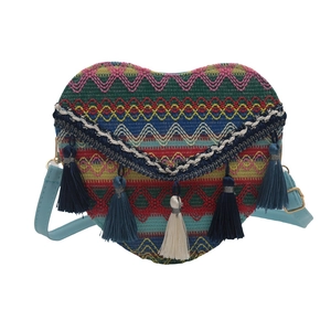 Handwoven bohemian heart-shaped crossbody bag with colorful patterns and tassels