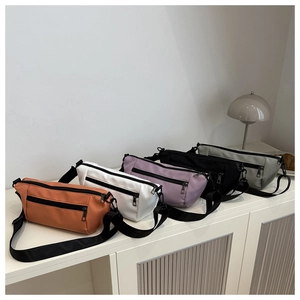Minimalist nylon crossbody bags displayed in orange, white, purple, black, and gray colors