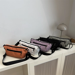 Minimalist candy-colored nylon crossbody bags in five colors with adjustable straps
