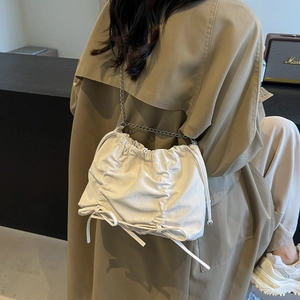 White pleated cloud tote bag with drawstring and thin metal chain strap for women