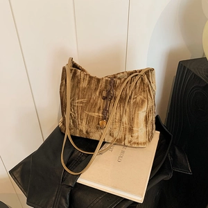 Brown velvet tote bag with golden bamboo pattern and long leather shoulder straps