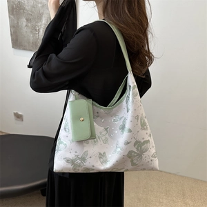 Large butterfly print tote bag with a small coin purse charm for commuting