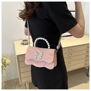 Pink pearl handle crossbody bag with marble texture and silver butterfly buckle detail