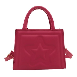 Chic magenta square handbag with embossed star detail and adjustable crossbody strap