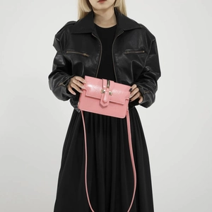 Fashionable bright pink rectangular flap crossbody bag with gold metal buckle and leather strap