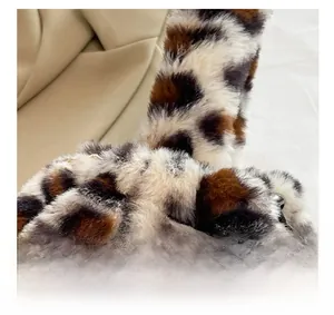 Close-up of leopard print plush faux fur material showing soft texture and animal pattern