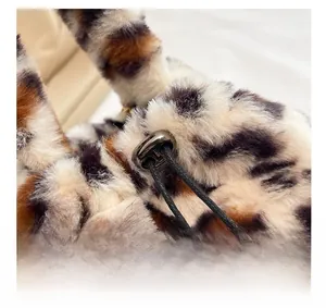 Detail of leopard print plush bucket bag featuring soft faux fur and adjustable drawstring