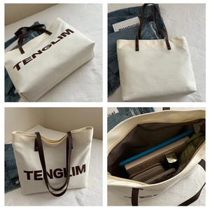 Detailed interior of the large white canvas tote bag showing spacious storage capacity