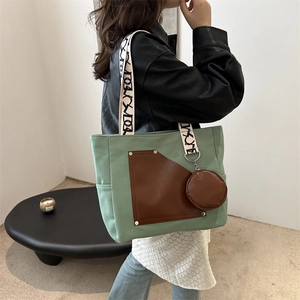 Morandi green canvas tote with brown leather pocket and artistic patterned wide strap