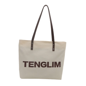 Minimalist canvas tote bag with brown leather handles and large TENGLIM lettering print