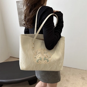 New Chinese-style beige tote bag with floral lace embroidery and golden hardware detail