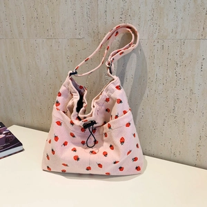 Pink corduroy crossbody bag with strawberry print and adjustable wide strap