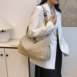 Minimalist large capacity khaki canvas crossbody bag with wide adjustable shoulder strap