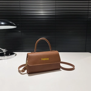 Brown vintage faux leather crossbody bag with top handle and fashion print text