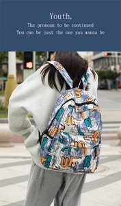 Close-up of lightweight graffiti backpack featuring vibrant abstract letter prints