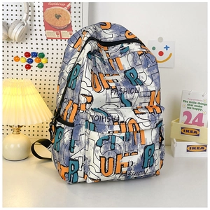 Detail of canvas backpack with street graffiti print and functional front zipper pockets